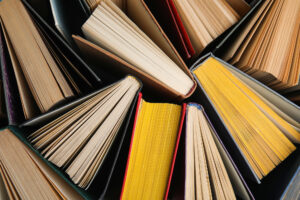 Collection of books representing shared human rights narratives, education, and the power of storytelling