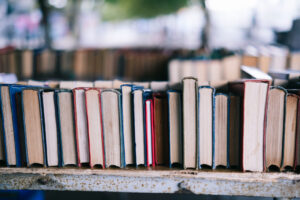 Stack of books symbolizing knowledge, storytelling, and the power of sharing human rights narratives